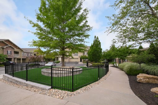 the view of a yard with a wrought iron fence at Sovereign at Overland Park, Overland Park, 66213