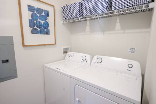 A white washing machine in a laundry room. at Overland Park, Pickerington, OH