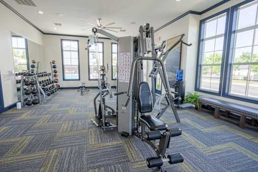 A gym with a variety of equipment including a leg press machine. at Overland Park, Pickerington, OH, 43147