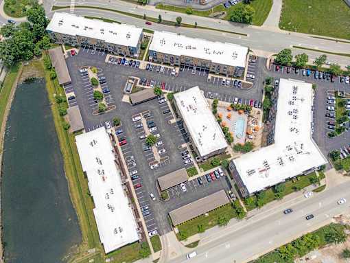 A parking lot with a building in the background. at Penn Circle, Indiana, 46032