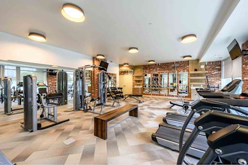 A gym with treadmills, weights, and exercise equipment. at Penn Circle, Indiana, 46032