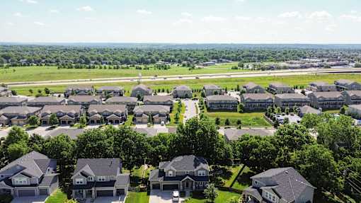A suburban neighborhood with houses and trees.