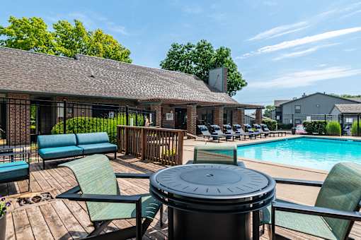Poolside area with seating at Springhill Apartments, Overland Park, Kansas