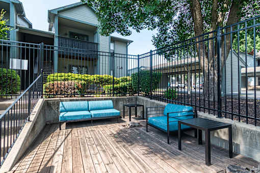 Wooden Deck with blue couch at Springhill Apartments, Overland Park