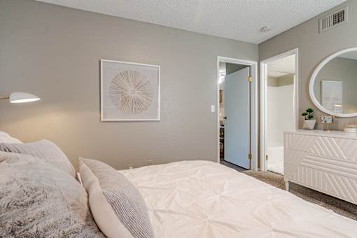 Bedroom with dresser and mirror at Springhill Apartments, Overland Park, KS, 66213