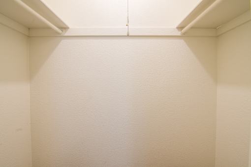 A white wall with a white ceiling.