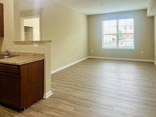 A large empty room with a sink and a window at The Greyson, Ohio, 43026