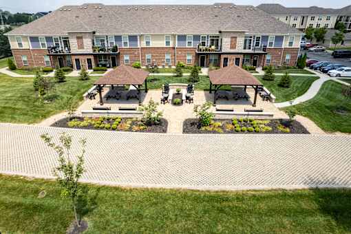 A large building with a lawn in front of it. at The Greyson, Hilliard