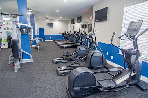 A gym with treadmills and exercise equipment. at The Greyson, Ohio