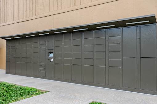 A large grey garage door with a small square window in the middle.