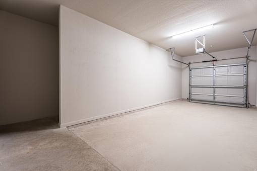 A room with a white wall and a metal shelf  at Waterstone at Cinco Ranch Apartments, Katy