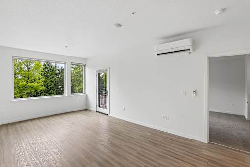 A room with a window and a door.