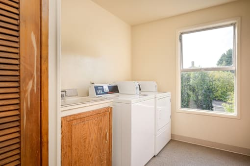 A laundry room with a washer and dryer.