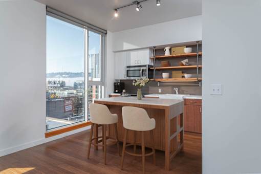 A kitchen with a view of the city.