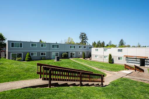 The Scholls Apartments Grass courtyard with stairs, paths and view of exterior apartment building