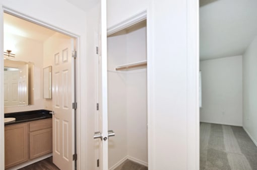 A white door is open to a hallway.