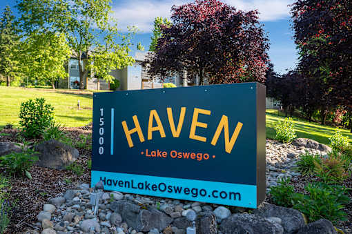 A sign for Haven in Lake Oswego stands in front of a landscaped area.
