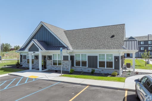 the front of a house with a parking lot