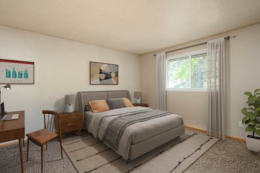 A bedroom with a bed, chair, and window.