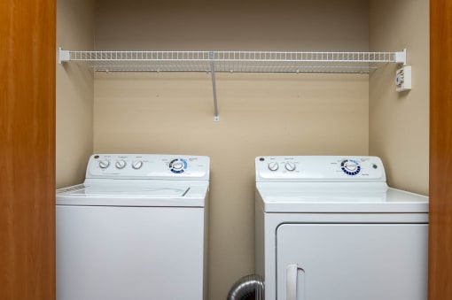 Full size side by side washer and dryer with shelf and storage