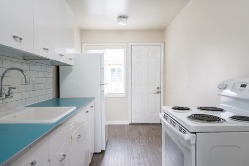 Clinton Court| Kitchen with White Appliances