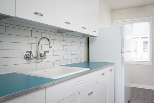 Clinton Court| Kitchen with White Appliances