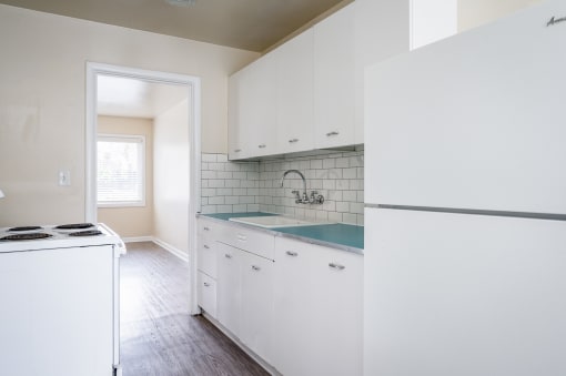 Clinton Court| Kitchen with White Cabinets
