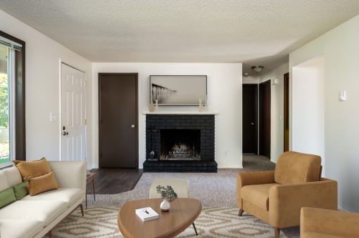 a living room with a fireplace and a couch and a coffee table