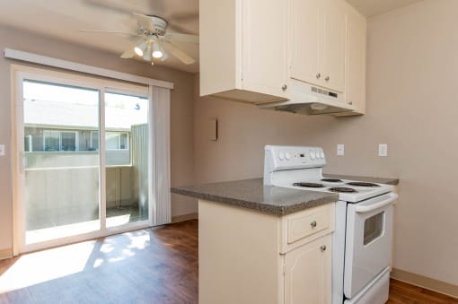 Kitchen and Dining Room with views to the balcony/patio