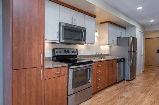 The Morgan | #404 Kitchen with beautiful cabinetry and stainless steel appliances