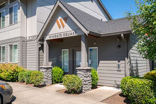 A building with a sign that says Wingate Square.