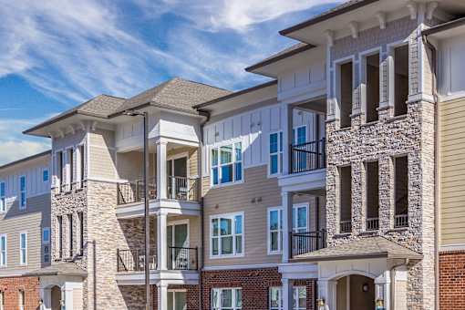 A row of modern apartment buildings with balconies and multiple stories at Crabtree Lakeside Apartments, Raleigh, North Carolina