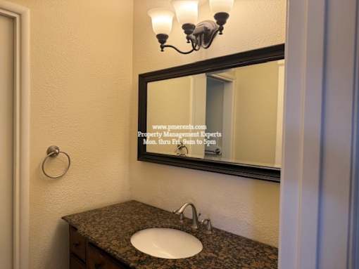 A bathroom sink with a mirror above it.