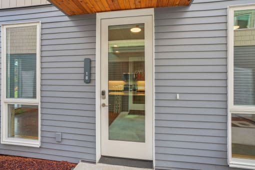 the front door of a house with a glass window