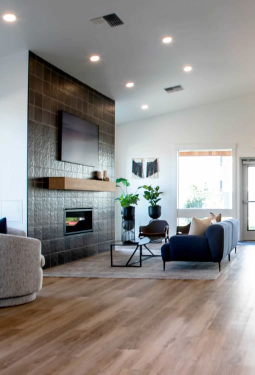 a modern living room with a fireplace and tv