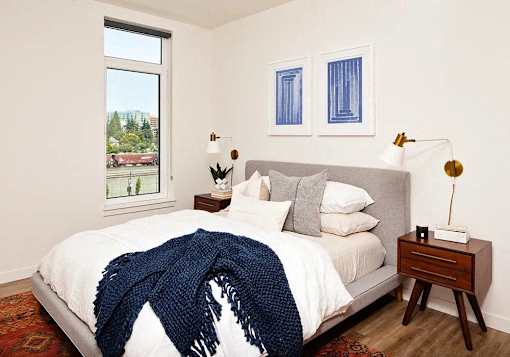 Bedroom with queen bed and window