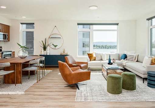 Living room with large windows and arranged furniture in two bedroom two bathroom