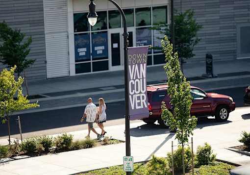 Couple walking on boardwalk on Waterfront Way