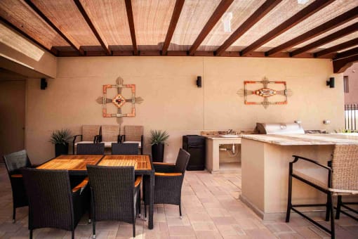 A dining room with a wooden table and chairs.