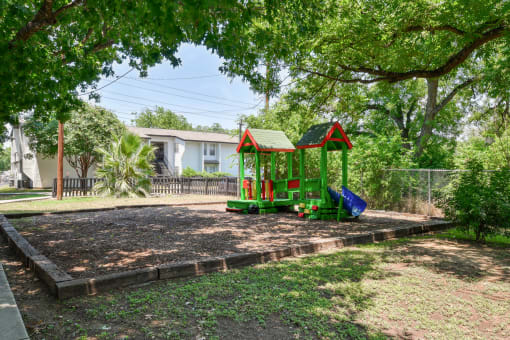 a pretend playground in a park with trees