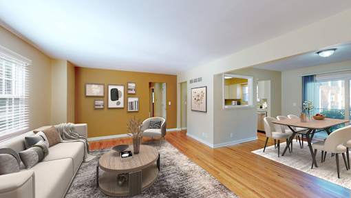 A living room with a grey couch and a coffee table.