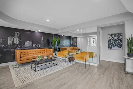A modern living room with a black mural on the wall.