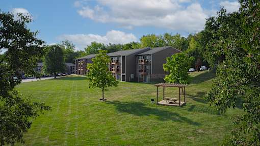 A modern building with a green lawn in front.