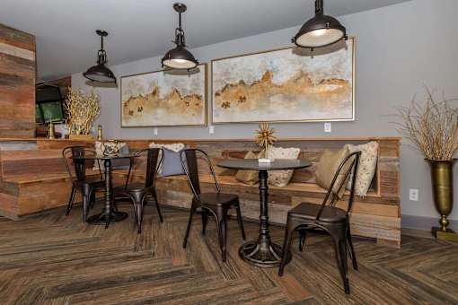 A dining room with a wooden table and chairs.