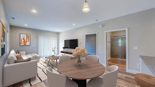 A modern living room with a wooden table and white chairs.