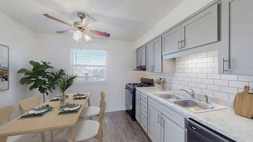 A kitchen with a dining table set for four.