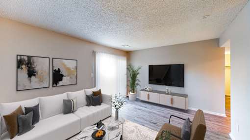 the preserve at ballantyne commons living room with white couch and tv