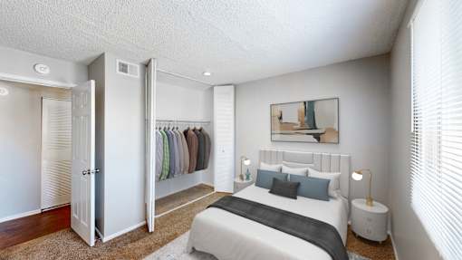 a bedroom with a bed and a closet