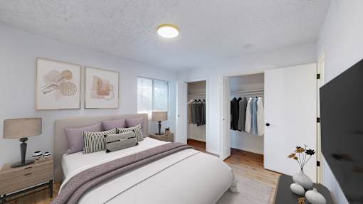 A bedroom with a large bed and a wardrobe.