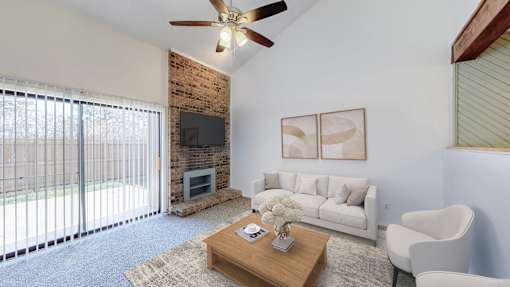 A living room with a fireplace and a couch.